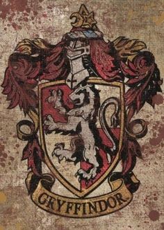 a grungy image of a coat of arms with the words greyfindor on it