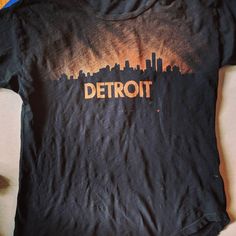 a black shirt with the word detroit on it