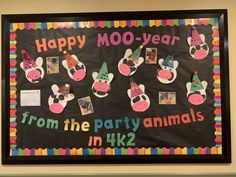 a bulletin board with pictures of animals and the words happy moo - year from the party animals in k2