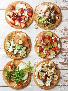 four pizzas with different toppings arranged on top of each other