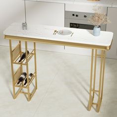 a white marble table with gold legs and wine rack on the counter in a kitchen