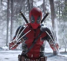 the deadpool character is holding two swords