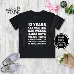 "Looking for a unique cool 12 year old gift? This Midnight Made® 12 Years of Awesome T-shirt Tee is sure to delight! This 12th Birthday shirt is a perfect Twelfth Birthday, Bday, or Days Old Fun Theme Party gift for a 12 year old. This under 30 dollars novelty graphic 12th Birthday Tshirt Top is also a great present or gift idea for Christmas, Hanukkah, or other holidays from Mom and Dad. T-SHIRT DETAILS:  Made to order and individually printed directly on the item (NOT an iron-on decal) on a comfortable, high quality, 100% cotton (fiber content may vary depending on color) short-sleeved T-Shirt. The back is blank, unless pictured otherwise. Multiple colors (light designs on dark shirts, dark designs on light shirts, and high-contrast full-color designs print well on either dark or light s Old Tshirt, Dark Designs, Tenth Birthday, Old Shirts, Birthday Tshirts, Pregnancy Shirts, Top Gifts, Birthday Shirt, Best Part Of Me