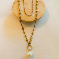 Pearls are traditional and elegant. This necklace combines a classic symbol and makes a layered look simple and easy! 2 layers of chain and a solitaire freshwater pearl at the base. Perfect for any occasion . Pearls are also the June Birthstone. ⬩10-12mm Oval shape Pearl ⬩22 inch Brass & 18 inch Plated Brass Layered necklace ⬩Available in White/Bronze, and Blue/Gunmetal ⬩Pearl is highly feminine and known as a “stone of sincerity” This item will ship with gemstone information on the Santore Jewe Multi-strand Metal Necklace With Pearl Chain, Metal Pearl Charm Necklace, Multi-strand Metal Pearl Chain Jewelry, Double Strand Pearl Chain Necklace As Gift, Metal Pearl Drop Necklace, Gold Layered Necklace With Pearl Drop For Gift, Gold Double Strand Pearl Necklaces, Pearl Layered Necklace With Pearl Charm For Gifts, Pearl Chain Metal Layered Necklace For Gift