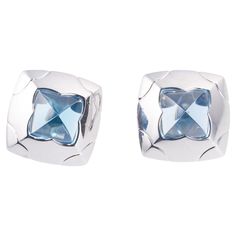 Pair of signature Pyramid earrings, crafted by Bvlgari in 18k white gold, with blue topaz in the center. Earrings measure 25mm x 25mm. Marked: Bvlgari, 750. Weight of the pair - 32.8 grams. Pyramid Earrings, Blue Topaz, Clip On Earrings, Topaz, Gold Earrings, Jewelry Earrings, White Gold, Gold, Blue