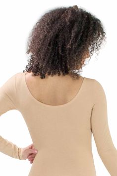 A versatile and simple long sleeve leotard in the color nude/beige. A staple must-have in every's dancers wardrobe. (No lining) Cotton blend fabric is thicker than the Seamless Microfiber Undergarment Leotard for more coverage. Style: BM5424Detail: No LiningFabric: Cotton / Polyester / SpandexSizes: S, M, L, XLColors: NudeMade in USAActual color may vary slightly from your monitor. For wholesale inquiries, please call us at (626) 336-2111 or email us! Long Sleeve Leotard, Simplistic Design, Nude Color, Leotards, Women Long Sleeve, Open Shoulder Tops, Dancer, Cotton Blend, Long Sleeve