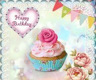 a birthday card with a cupcake and flowers