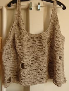 a crocheted bag hanging from a hook