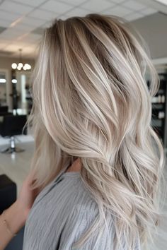 Whether you're a born blonde or just blonde at heart, the right shade of this beautiful and timeless hair color can instantly transform your look from just pretty to straight-up showstopping. If you need help picking the perfect hue, we've got you covered. From icy platinum to warm honey tones,… Icy Blonde Baylage, Blond With Shadow Root Ash, Champagne Blonde With Lowlights, Cream Blonde Hair Dark Roots, Blonde Balayage With Root Tap, Straight Blonde Balayage Hair, Natural Looking Platinum Blonde, October Blonde Hair, Chamomile Blonde Hair