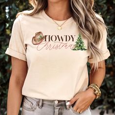 CHECK OUT OUR MATCHING SWEATSHIRT IN OUR SHOP! It's Cowboy Christmas season y'all! Embrace your inner country cowgirl and cowboy in this festive tee! Dressed up for work, dressed down for festive holiday pajamas, this shirt can do it all! Gift to you favorite cowgirl or cowboy.  Care instructions: Machine wash: cold (max 30C or 90F) Non-chlorine bleach as needed Tumble dry: low heat Do not iron Do not dry clean No Returns or Exchanges. Thank you so much for supporting our small business! Country Cowgirl And Cowboy, Pajamas Shirt, Cow Boys, Family Pjs, Country Cowboy, Country Cowgirl, Western Graphic Tees, Cowboy Christmas, Cowgirl Shirts