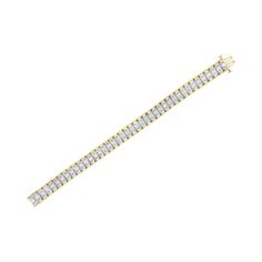 A must have for any serious jewelry collection, this stunning 14K yellow and white gold tennis bracelet boasts an impressive 5.0 carat total weight of diamonds with a whopping 217 individual stones. The bracelet features rectangular links with round, brilliant cut diamonds in four prong settings centered between baguette cut diamonds flush set into the wedged sides of the links, creating a reflective appearance. The interior of the links are 14K white gold, while the outside of the links are mad Gold Tennis Bracelet, Bracelet Tennis, Baguette Cut Diamond, Baguette Cut, Tennis Bracelet, Brilliant Cut Diamond, Diamond Studs, Ring Bracelet, Bracelet Making