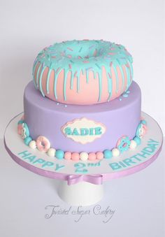 a birthday cake decorated with icing and sprinkles