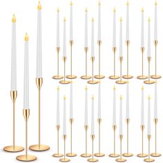 many white candles with gold tips are lined up in rows on a white background photo