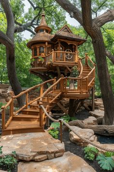 a wooden tree house sitting in the middle of a forest