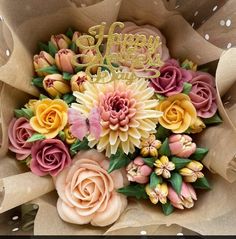 a bouquet of flowers with the words happy new year written in gold lettering on top