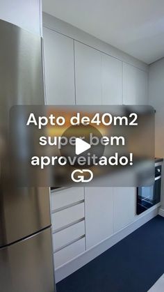 a kitchen with stainless steel appliances and white cabinets is featured in an ad for appto de 40m2