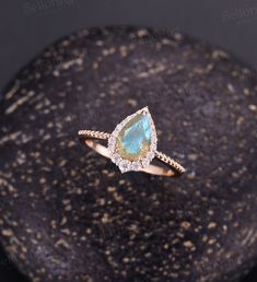 Vintage Labradorite engagement ring Pear shaped Rose gold ring milgrain art deco moissanite ring unique art deco ring anniversary ring Back to Belloring shop: https://www.etsy.com/shop/BrilliantRing?ref=l2-shopheader-name ---------------------------Specifications---------------------- Engagement ring Center Stone - 6*9mm pear cut Labradorite Side stones - 0.323ct Moissanite or Diamond ---------------------------DIMENSIONS----------------------- The Width of the Band - 1.4mm The Thickness of the Pear-shaped Diamond Ring As A Gift, Teardrop Diamond White Jewelry For Proposal, Diamond White Teardrop Jewelry For Proposal, Teardrop Diamond Jewelry For Proposal, Diamond White Rose Cut Diamond Proposal Jewelry, Diamond White Rose Cut Diamond Jewelry For Proposal, Teardrop Diamond Accent Jewelry For Proposal, Pear-shaped Jewelry With Diamond Accents For Proposal, Pear-shaped Diamond Proposal Jewelry