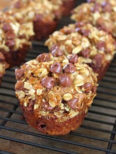 several muffins are cooling on a wire rack