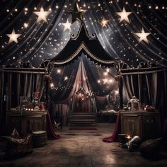 a bed with stars hanging from it's ceiling in a room filled with curtains