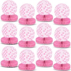 a set of twelve pink tissue balls with some white squares on the top and one in the middle