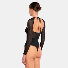 The MARGOT Bodysuit exudes an elegant and sophisticated style. It features cute see-through mesh detailing on the bodysuit and mesh sleeves, adding a captivating allure. Whether paired with a skirt or pants, this versatile bodysuit is perfect for a night out.Fitting:- The bodysuit runs small so we recommend going one size up.Info:- 85% Nylon, 15% Elastane- Closure at the bottom - 2 hooksModel info:176 cm tall, dressed in size S(EU 36, UK 8, US 4)Designed in EuropeWashing instructions: Mild deter Bodysuit Outfit Classy, Sheer Bodysuit Outfit, Sheer Bodysuit, Glamorous Party, Confident Style, Body Suit Outfits, Mesh Bodysuit, Bodysuit Fashion, Mesh Sleeves