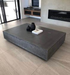 a living room with a large gray coffee table