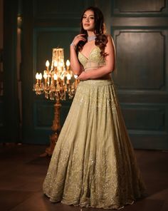 This pistachio green lehenga set features all-over sequin, crystal, cutdana, and bead embroidery. Paired with a dramatic feathered dupatta and strappy corset blouse embroidered with sequin and crystal detailing on net.DELIVERY TIMEPlease allow 8-12 weeks for your outfit to arrive.FABRIC DETAILSNetProfessional cleaning only. Anarkali Green Hand Embellished Choli, Pista Green Hand Embellished Festive Sets, Hand Embellished Pista Green Festive Set, Festive Hand Embellished Pista Green Set, Festive Hand-embellished Pista Green Set, Wedding Green Hand Embellished Choli, Green Hand Embellished Lehenga For Reception, Green Hand Embellished Anarkali Set For Reception, Designer Green Hand Embellished Anarkali Set