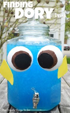 a blue jar with googly eyes on it and the words dory in front of it