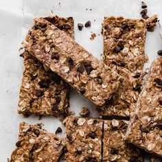 chocolate chip granola bars cut into squares and stacked on top of each other