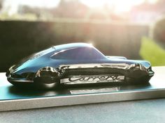 a toy car sitting on top of a table