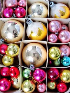 a box filled with lots of different colored ornaments