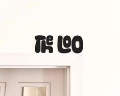 two black letters that are on top of a white door and the word'go'is above it