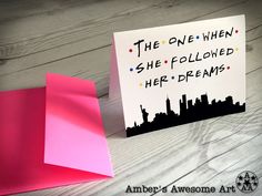 a piece of paper with the words she followed her dreams written on it next to a card