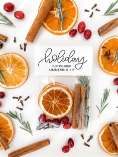 an assortment of oranges, cinnamon sticks and spices on a white background with the words holiday potpouri simmering kit