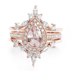 an engagement ring with a pear shaped morganite surrounded by diamonds