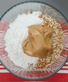 a bowl filled with some kind of food on top of a red and white table cloth