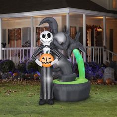 an inflatable halloween decoration with a skeleton holding a jack - o - lantern