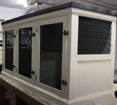 a large white cabinet sitting on top of a counter