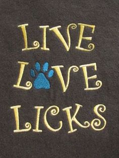 a t - shirt that says live love licks with a dog's paw on it