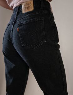 "Women's Vintage Levi's Jeans Orange Tab Black Denim SKU: OT L BLK 4 Made in Canada 100% Cotton high quality non stretch denim Waist snatching high waisted fit Curves beautifully around the hips Tapered straight leg Levi's Orange Tab ( has a similar fit to Levi's 512 ) YKK Zipper and Single Button Closure Stunning Dark Black Wash Item is in excellent Vintage condition with no significant flaws to note About the Fit: Model is 5,7\" and usually wears a modern women's size S - M, US 4 - 6, 28. The Classic High Rise Black Jeans, Classic Black Rigid Denim Bottoms, Black Fitted Rigid Denim Jeans, Classic High Waist Washed Black Bottoms, Classic High-waist Washed Black Bottoms, High Waist Black Rigid Denim Bottoms, Fitted Washed Black Rigid Denim Bottoms, Fitted Rigid Denim Bottoms In Washed Black, Classic Black Jeans With Pockets