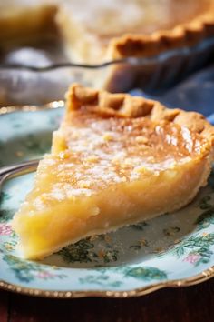 a piece of pie sitting on top of a blue and white plate