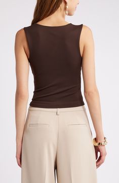 Sleek and contemporary, this figure-hugging tank is superversatile with smooth stretch fabric, wide straps and a slightly cropped length. 19" length (size Medium) Lined V-neck 75% nylon, 25% spandex Machine wash, tumble dry Imported Fitted Tank Vest With Built-in Bra, Brown Fitted Cami Tank Top, Brown Fitted Tops With Built-in Bra, Sleeveless Fitted Elastane Crop Top, Fitted Solid Cami Vest, Fitted Solid Color Cami Vest, Cropped Elastane Tank Top For Summer, Fitted Versatile Scoop Neck Tank Top, Sleeveless Tops With Built-in Bra And Elastane