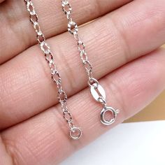 "---Metal Material: sterling silver WITH RHODIUM ---CLASP TYPE: SPRING RING ---LENGTH: 16\", 18\" ---WIDTH: 2.5mm ---PACKAGE: IN A BUBBLE ENVELOPE For more chains, please find here: https://www.etsy.com/shop/SterlingSilverBox?section_id=17168360&ref=shopsection_leftnav_1 We offer free standard shipping for orders more than $50. In addition, we provide 10% off for orders over $250. You don't need to apply any coupon. The system will calculate it when check out." Silver Hypoallergenic Link Necklace, Silver Sparkle, Bubble Envelopes, Metal Material, 22k Gold, Necklace Chain, Gold Plated Jewelry, Cable Chain, Spring Rings