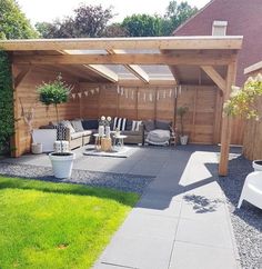 an outdoor living area with furniture and plants