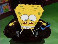 a cartoon character sitting in a chair on the floor