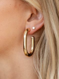 These oval style hoop earrings feature a shiny, thick silhouette to add more of a bold inspired design to the look. Trendy Oval Hoop Earrings, Bridal Shower Outfit, Denim Hoodie, Dressy Dresses, Capri Blue, Mother Denim, Maxi Dresses Casual, Denim Flares, Sunglasses Sale