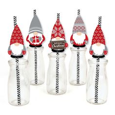 christmas gnome bottle toppers in red and gray with black chevrons on them