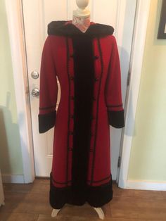 Vintage Sears Fashions Long woman's coat Bright red Wool like fabric I see no fabric tag  Pretty  red satin like lining Pockets Black faux fur  7 round  black buttons on each side and rope loops to close 1 extra button on inside   Nice hood Beautiful winter coat  Very nice and clean I see no stains no tares  Ready to wear  It says size 10 but smaller than that I do believe  Please see measurements with coat buttoned and laying flat   Arm pit to arm pit 18 inches across need to (double) for bust  Waist  about 15 inches across(double) Shoulder to shoulder about 15 inches Sleeves from shoulder about 22 inches long From shoulder to bottom of coat about 48 inches long  Across  the bottom of coat about 30 inches wide  if you need any more information or pictures please let me know We are offerin Red Long Outerwear With Buttons, Long Red Outerwear With Buttons, Elegant Red Fur Coat For Winter, Elegant Red Costume Outerwear, Wool Maxi Coat, Long Coat Women, Maxi Coat, Velvet Trim, Black Faux Fur