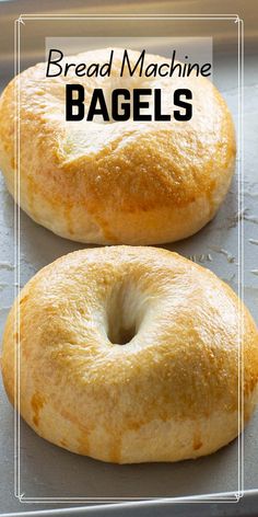 two bagels sitting on top of a baking pan with the words bread machine bagels