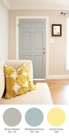 an image of a living room with yellow and gray colors on the door, walls and floor